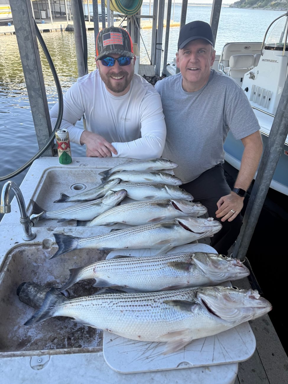 Anglers with their striped bass catch