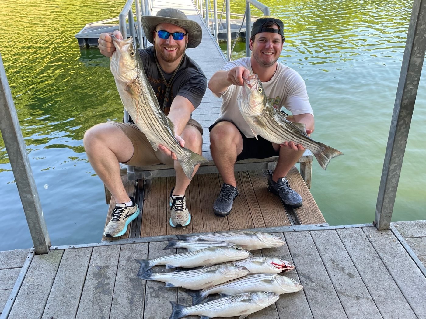 Two anglers with their catch